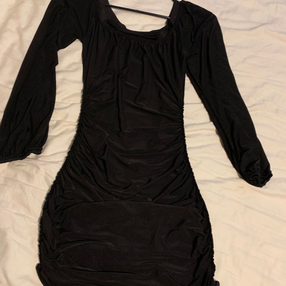Form fitting little black dress